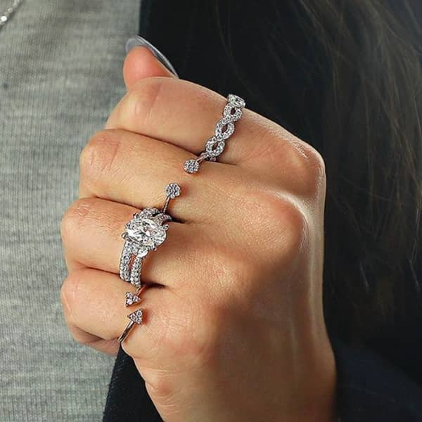 Woman showcasing diamond rings